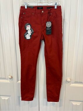 D. Jeans rust color jeans size 4/27